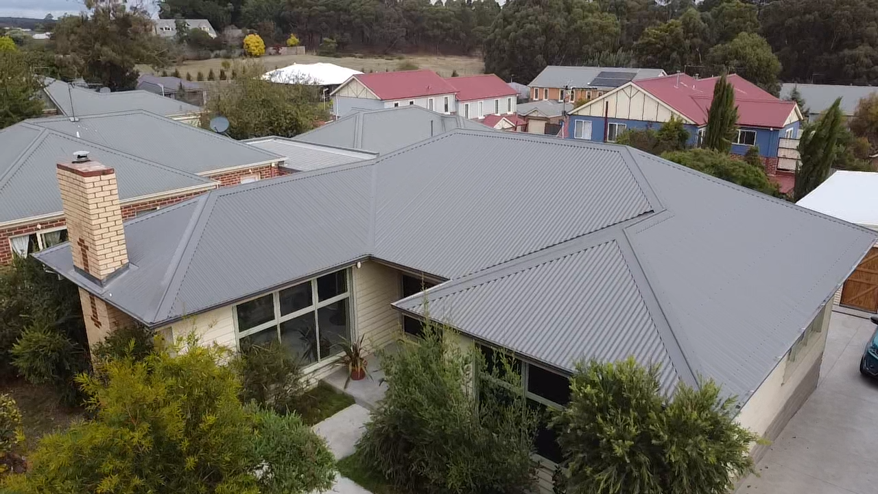 An Aerial View of a House With a Grey Roof — iFix Roofing Bendigo in Bendigo, VIC