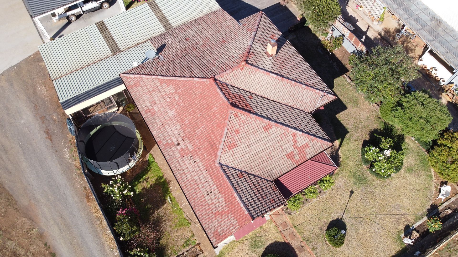 An aerial view of a house with a red tiled roof — iFix Roofing Bendigo in Bendigo, VIC