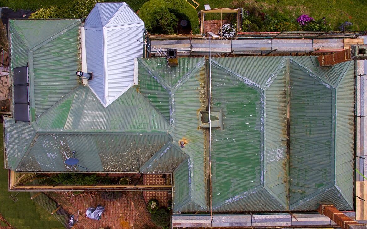 An Aerial View of a House With a Green Roof — iFix Roofing Bendigo in Eaglehawk, VIC