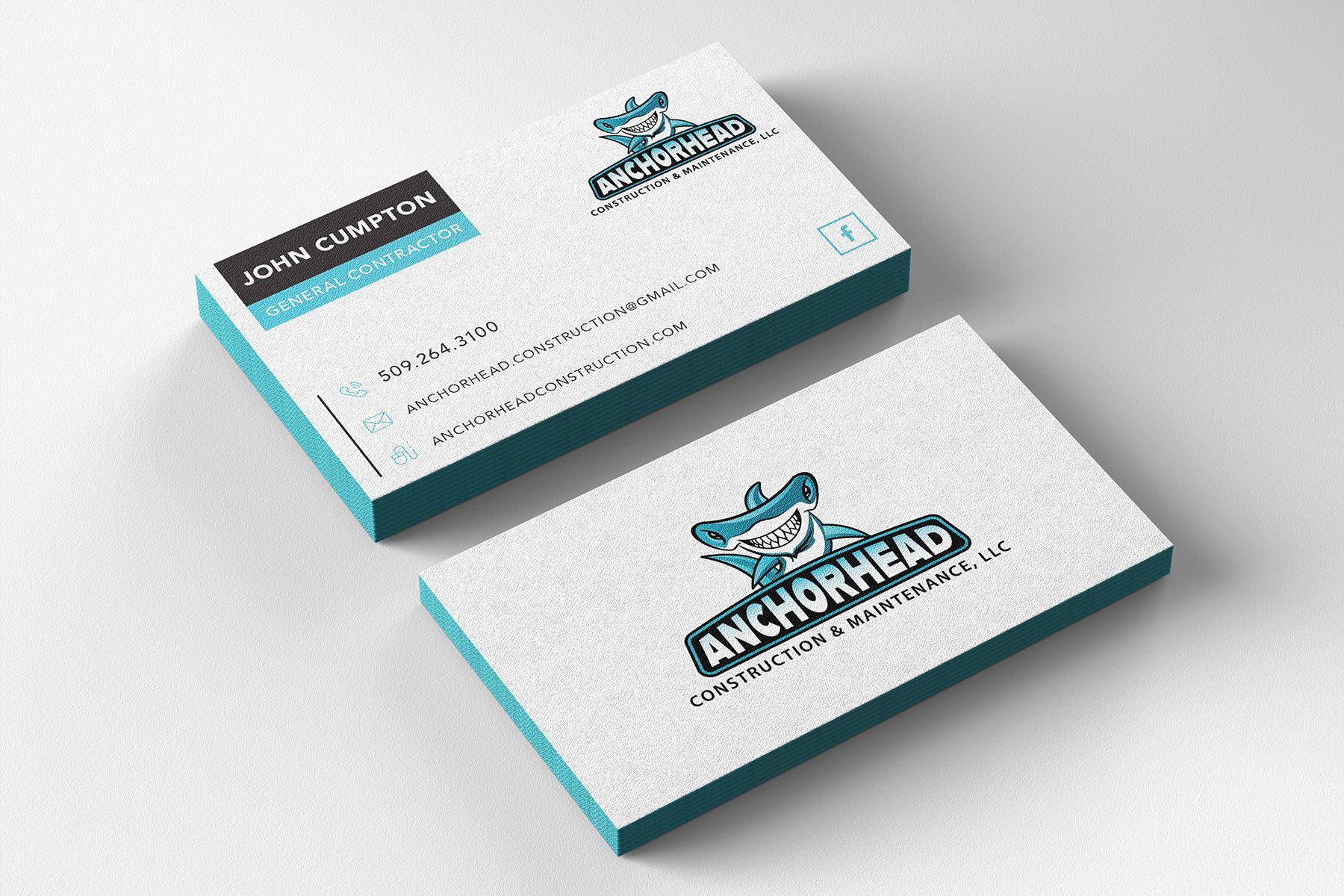 Business cards with the Anchorhead logo, stacked on a white surface with teal accents.