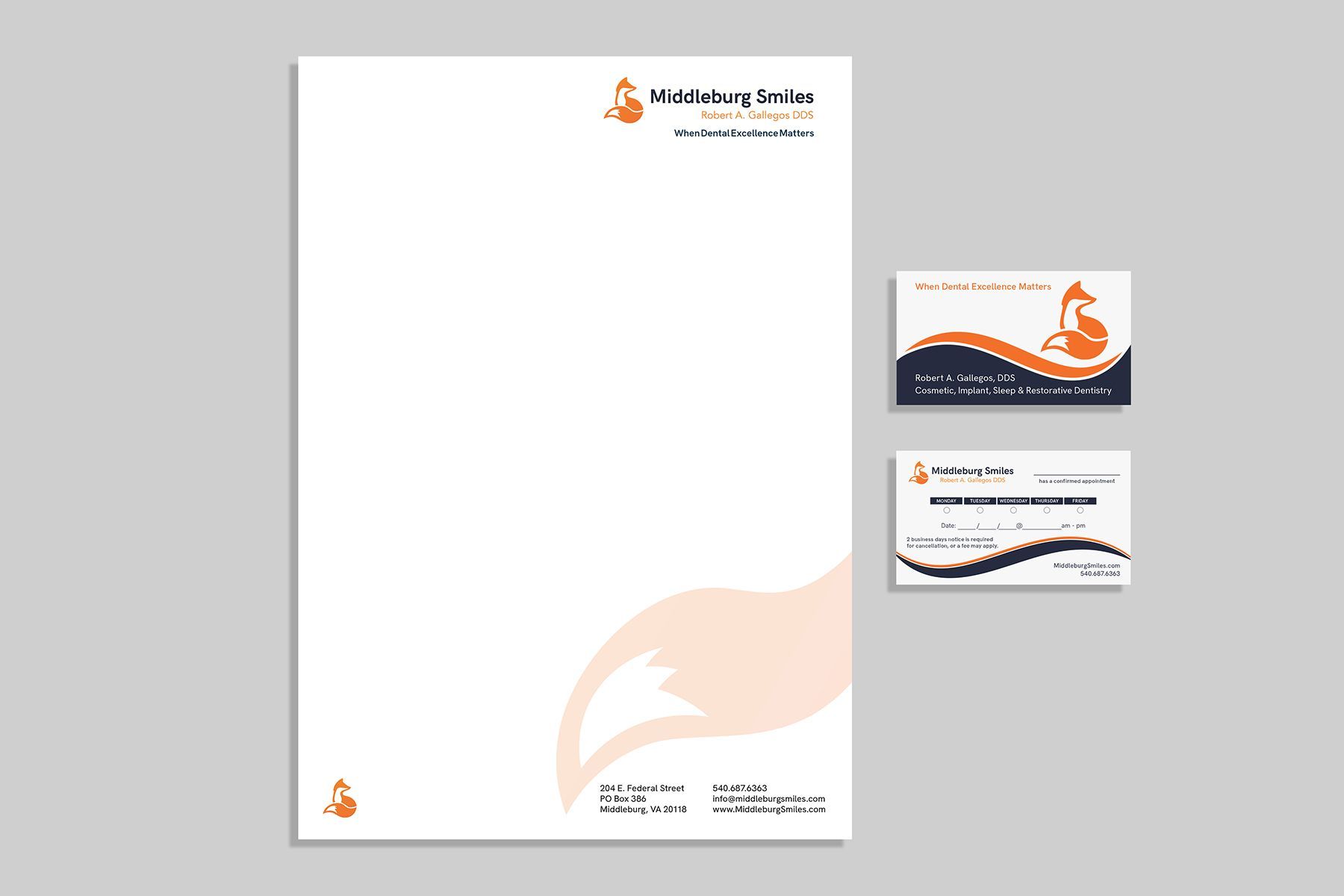 Letterhead and business cards with an orange and dark blue design.