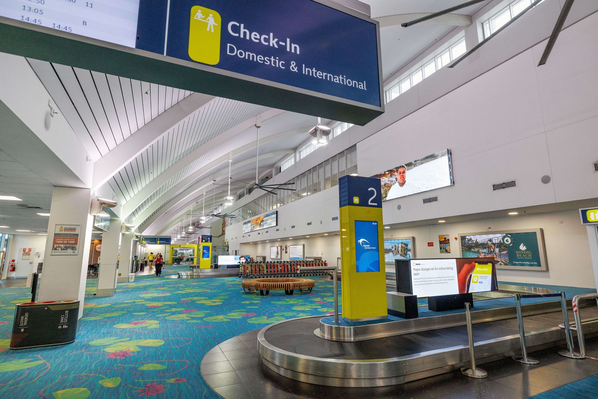 A check in area at an airport with a conveyor belt
