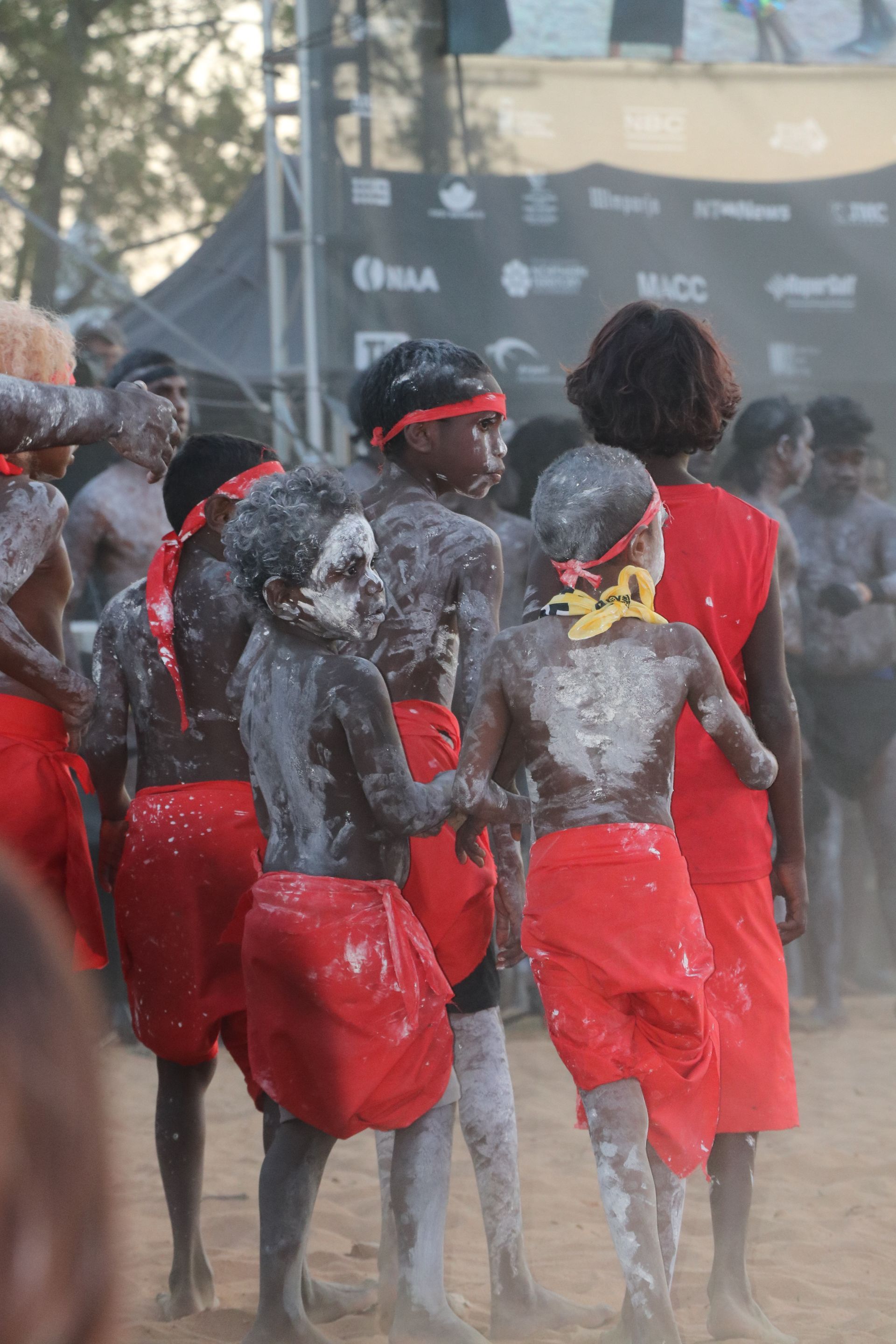 Indigenous kids at a festival with their indigenous attire.