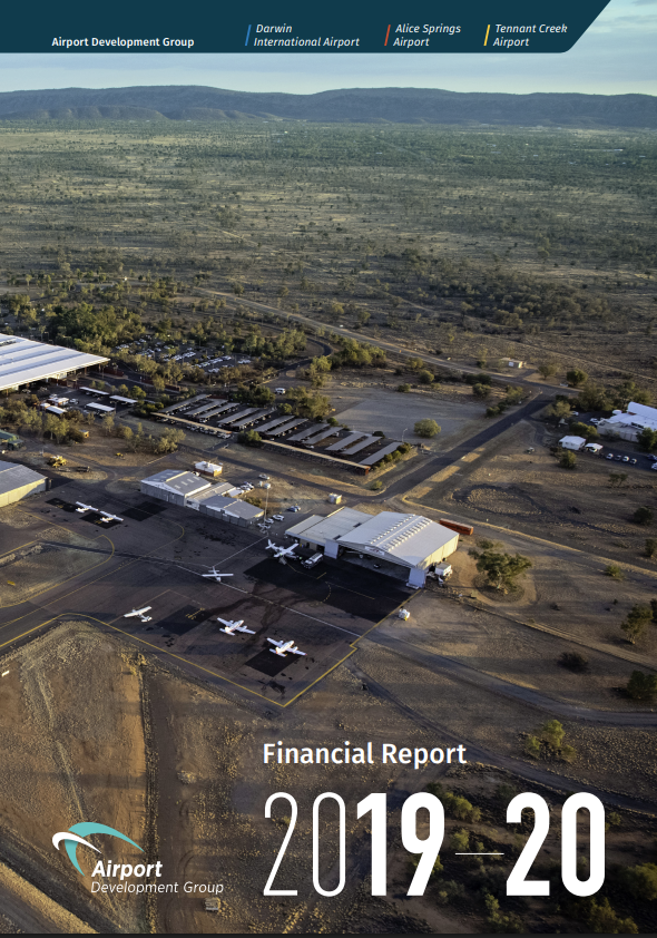 An aerial view of an airport with planes parked on the tarmac.