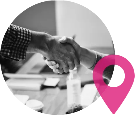 A black and white photo of a man and woman shaking hands.