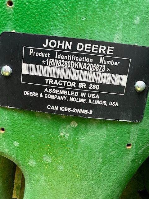 A black John Deere product identification plate for a model 8R 280 tractor, showing serial number 1RW8280DKNA205873.