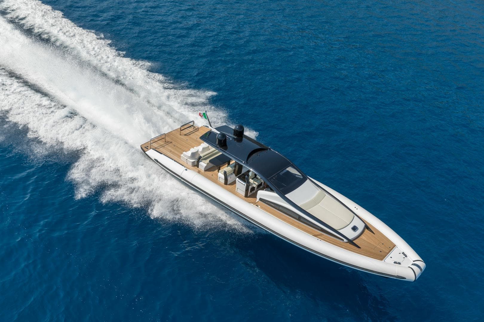 A large boat is floating on top of a body of water.