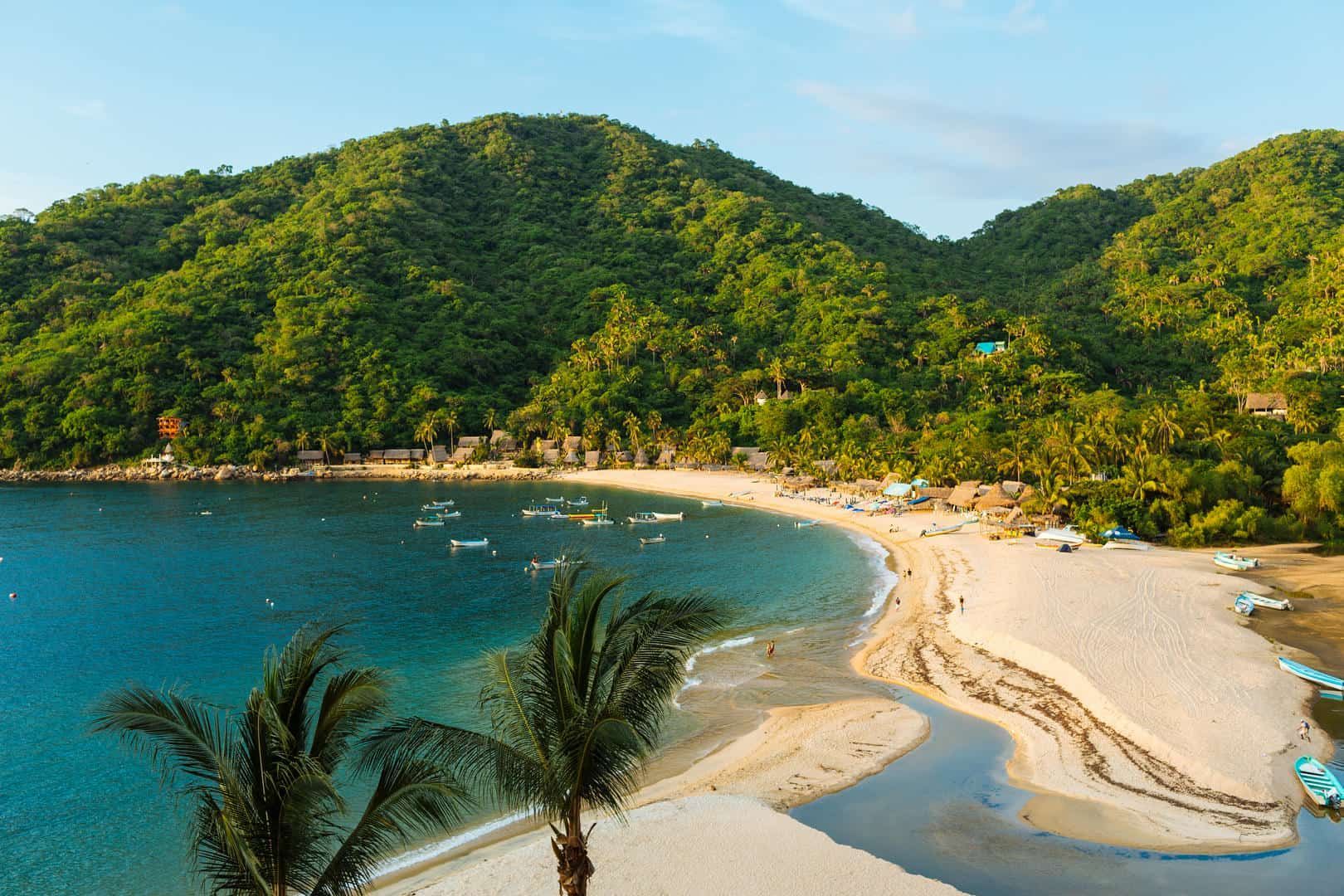 A large yacht is floating on top of a body of water at sunset.