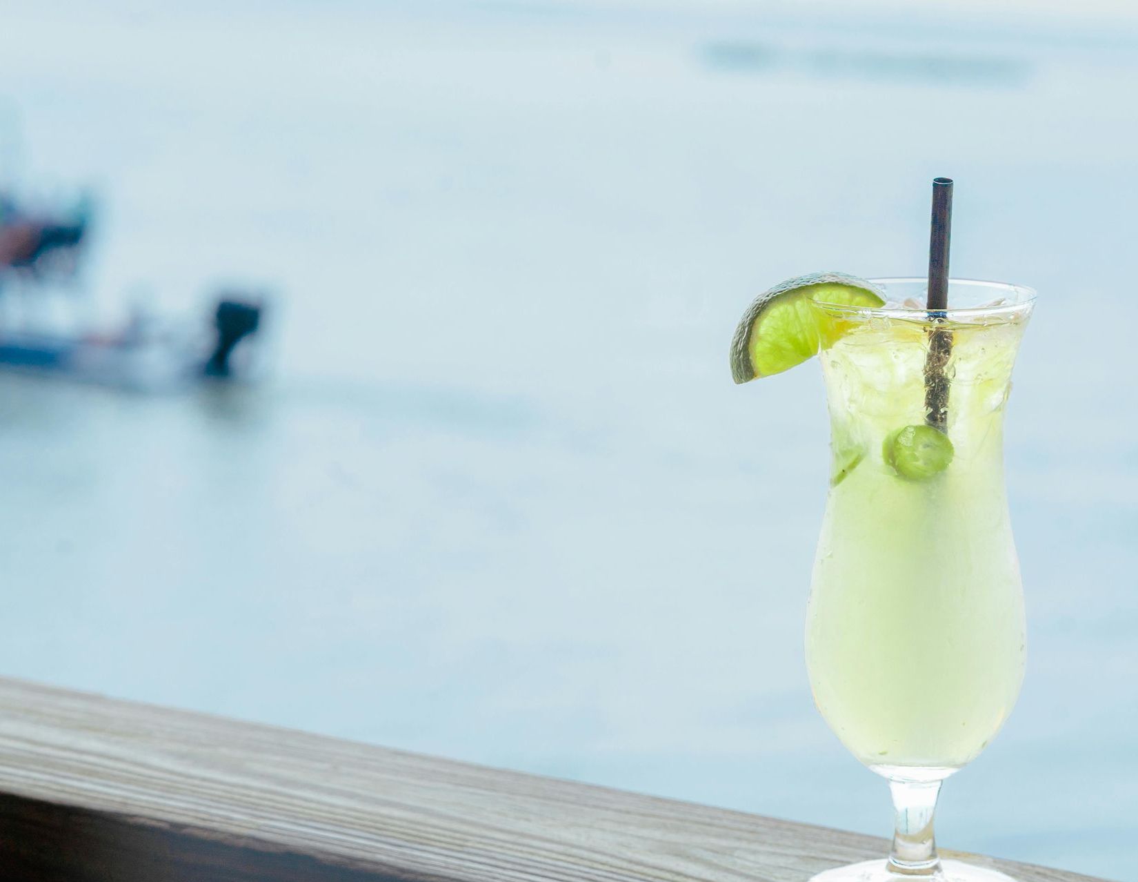 A large boat is floating on top of a body of water.