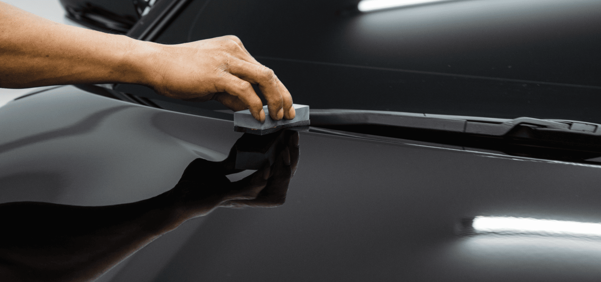 Applying protective coating on a black car