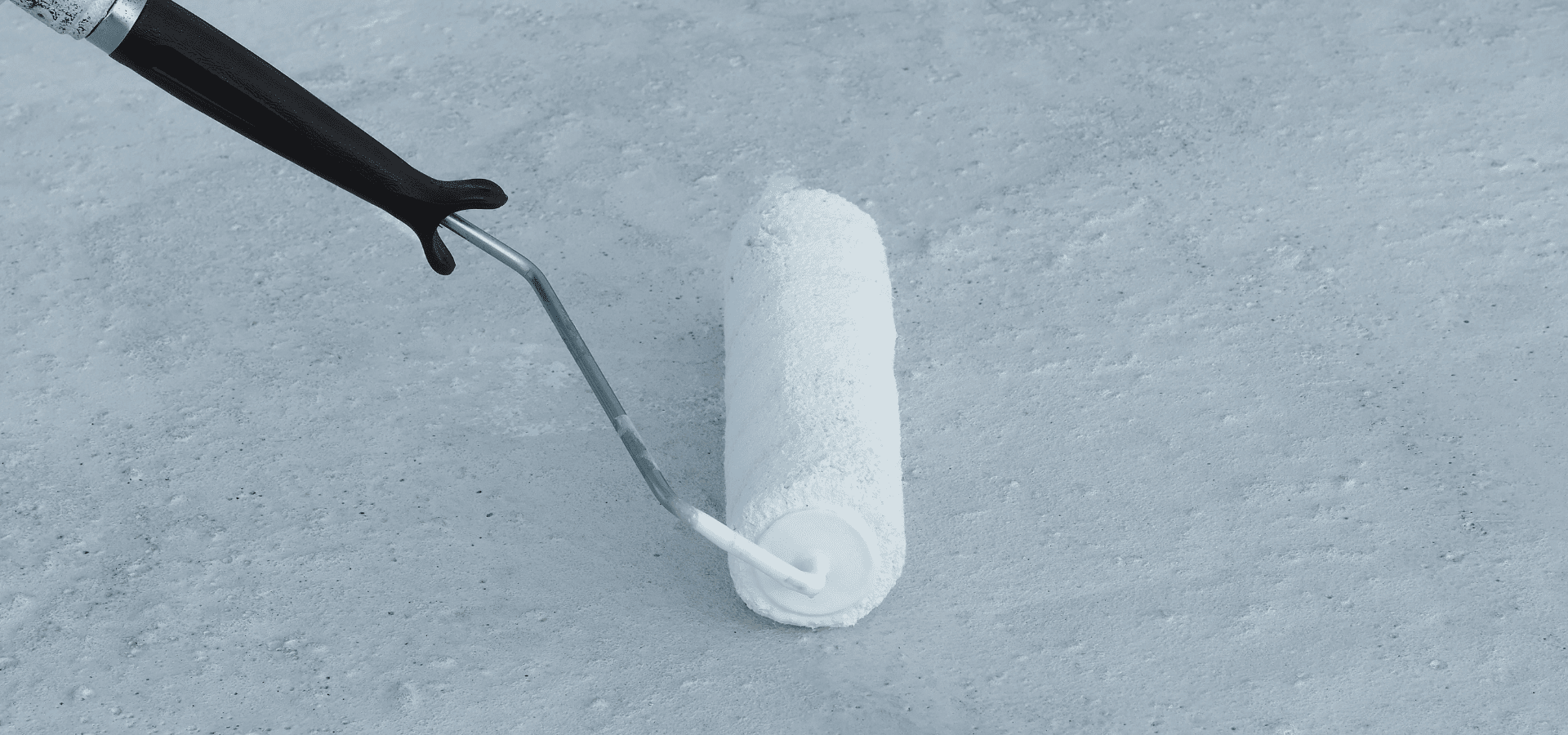 Applying waterproof coating to a roof with a roller