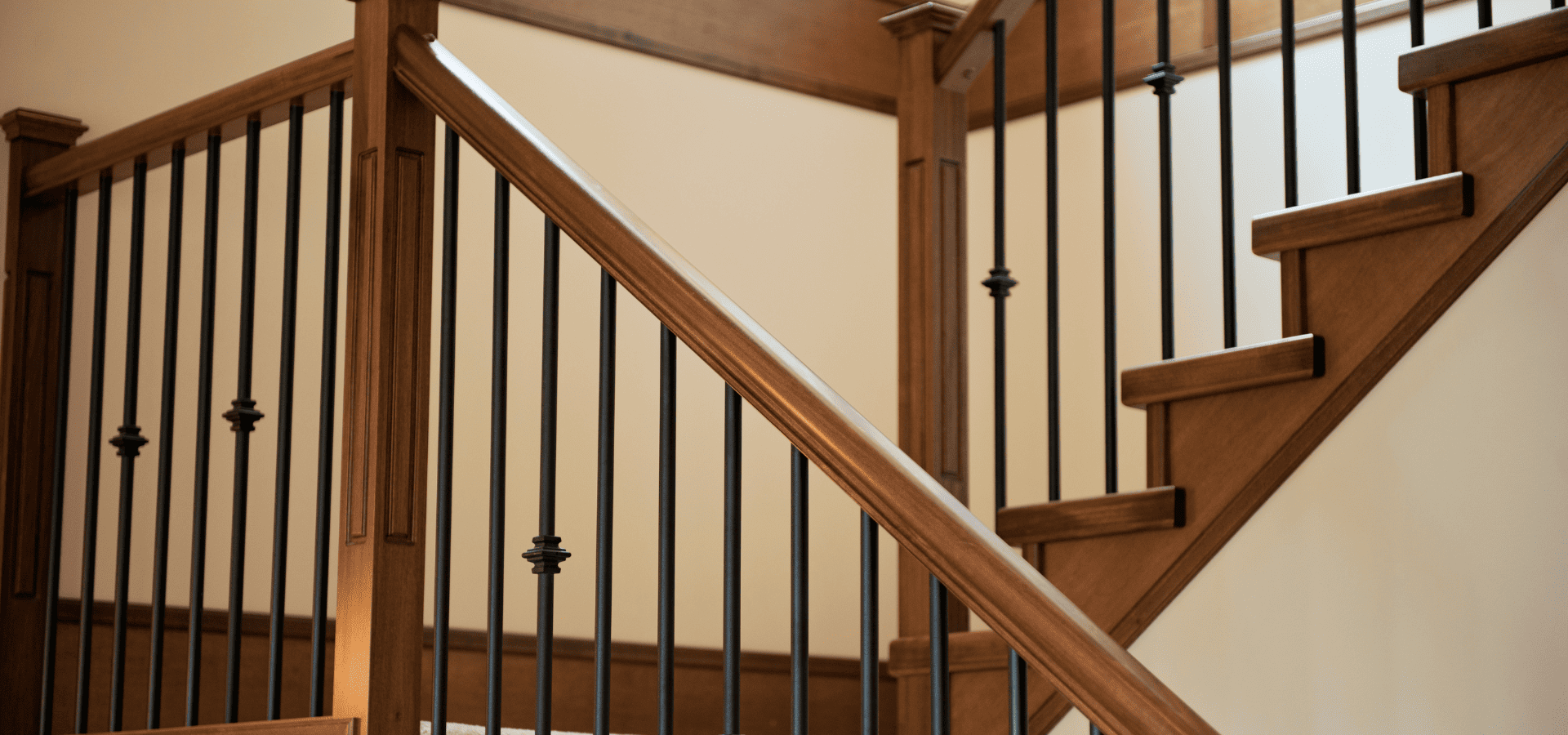 Wood stair railings elegantly painted with semi-gloss brown paint