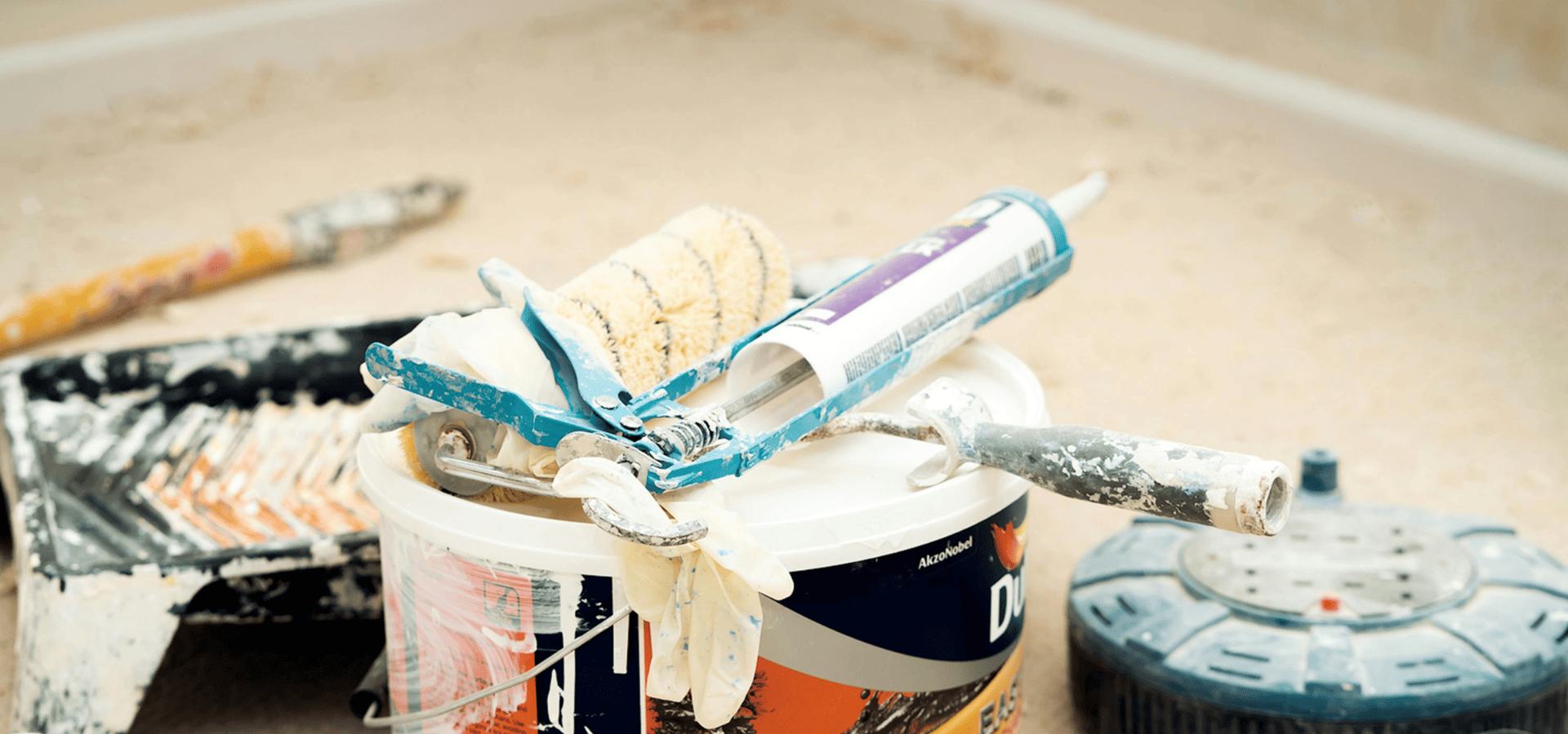 Garage door paint roller, paint, and filler