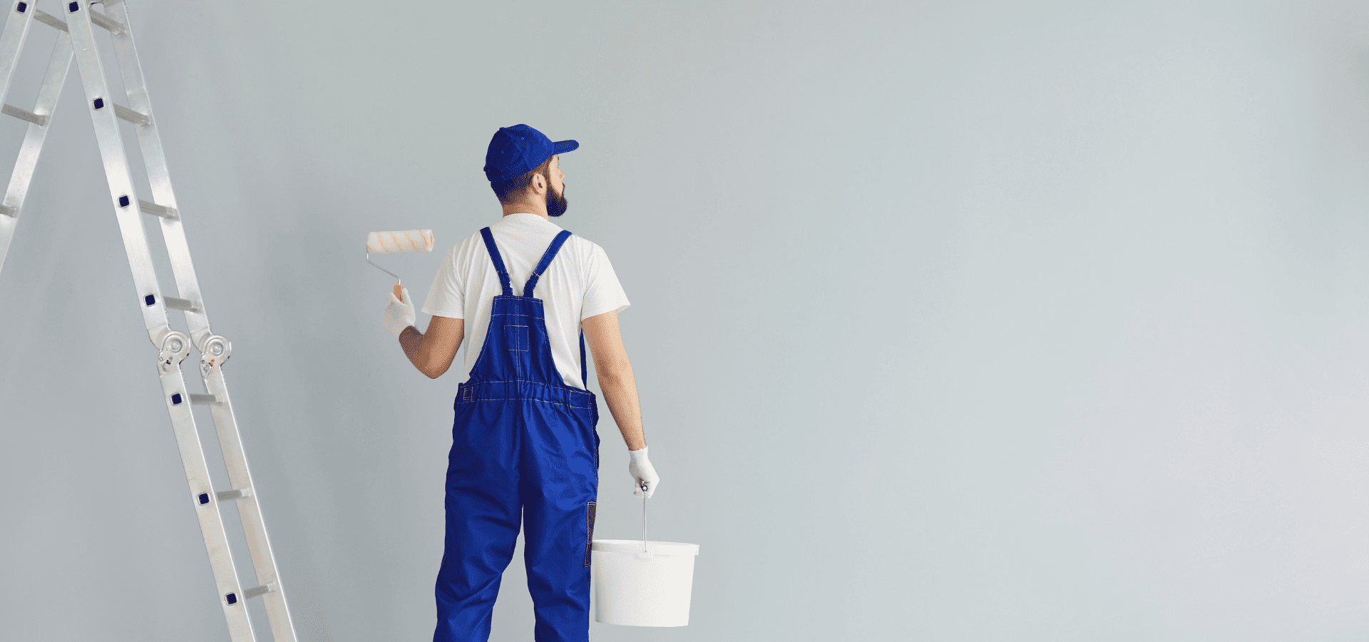 Professional house painter painting a Raleigh homeowner's living room walls