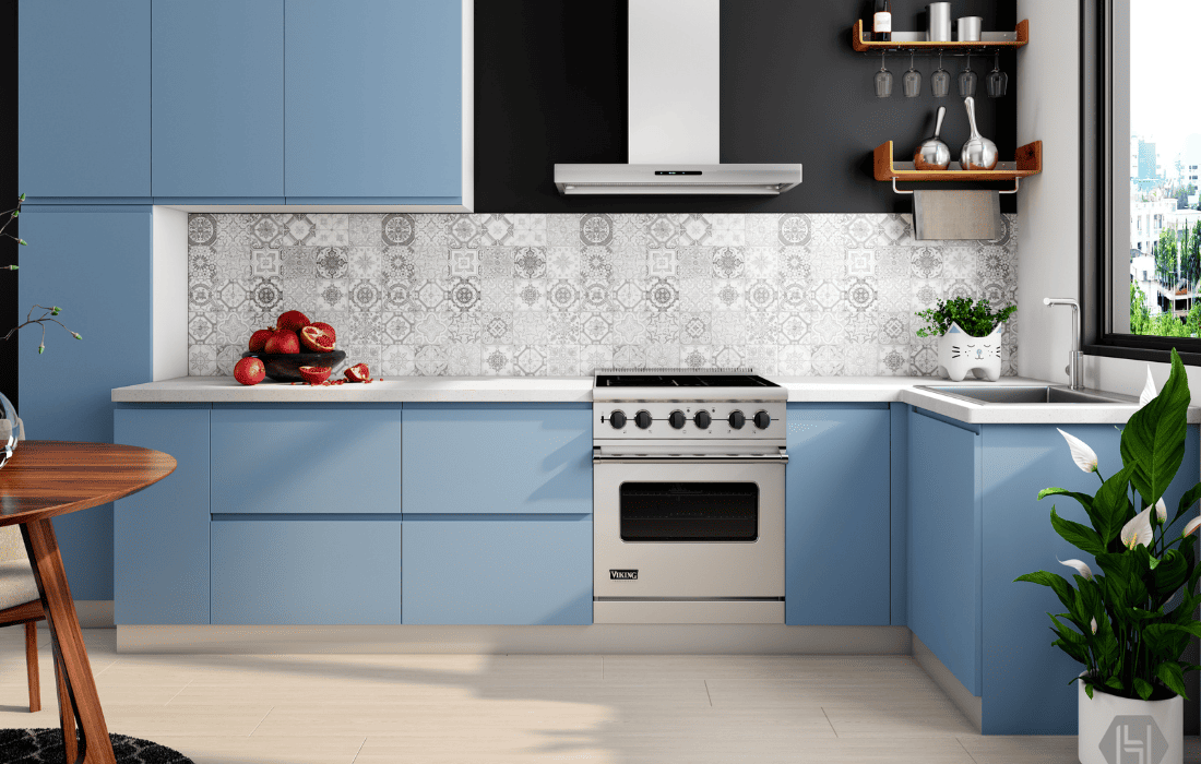 Blue kitchen cabinets painted by worker from Renewed Walls Painting