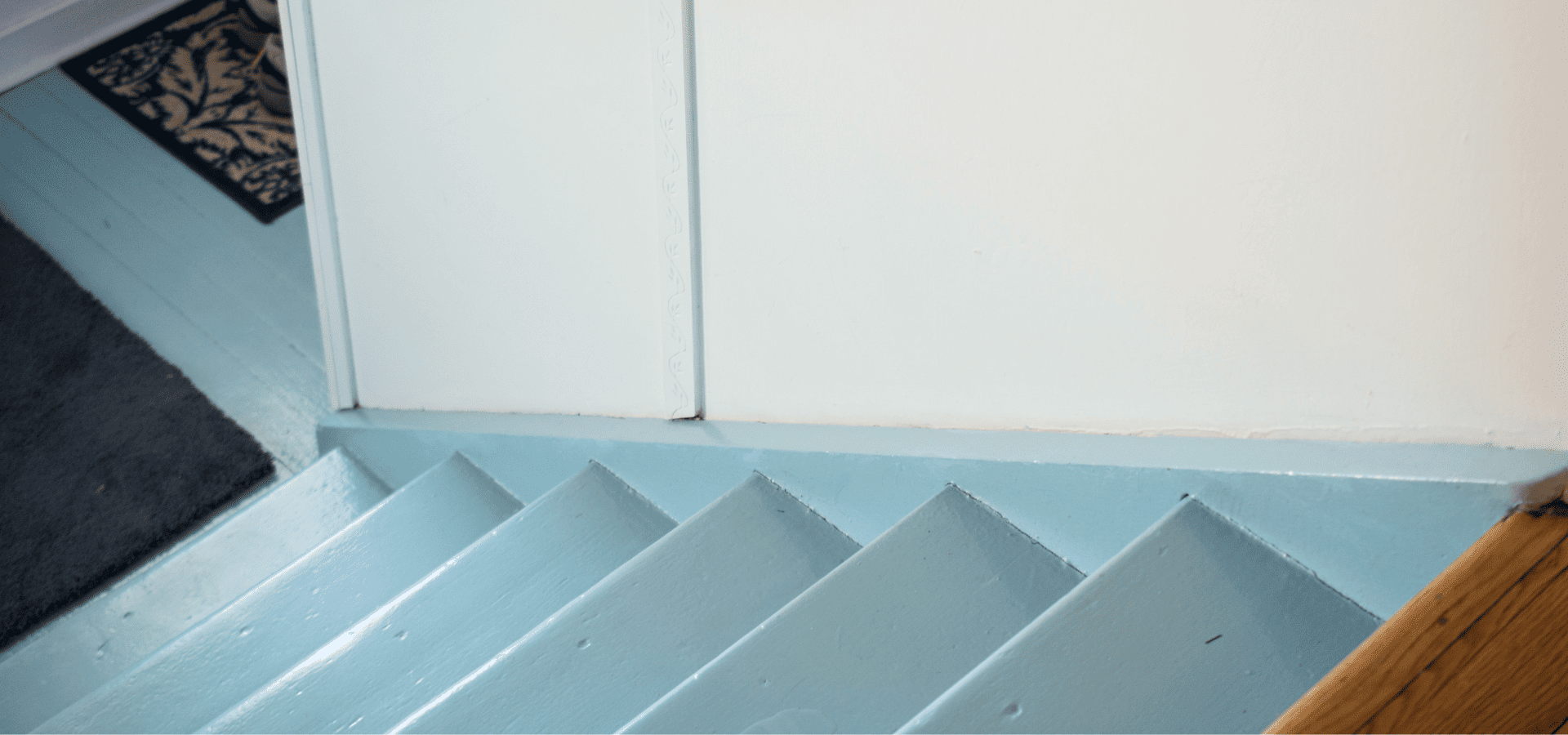 Wooden stairs painted in sky blue