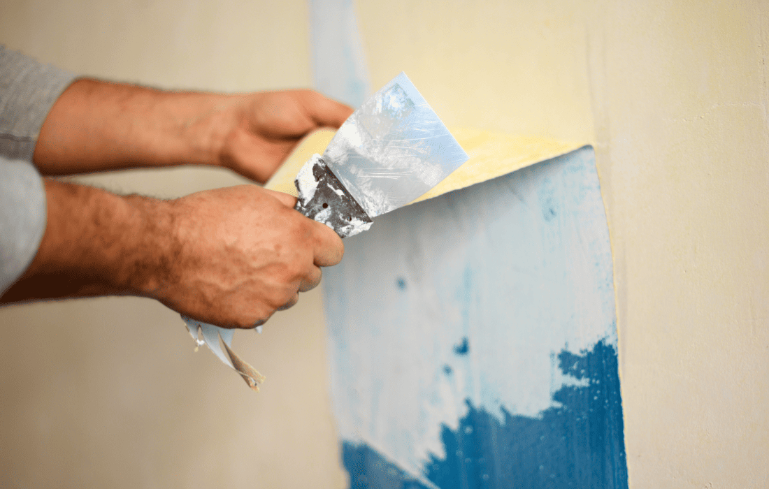 Removing blue wallpaper from a client's house walls