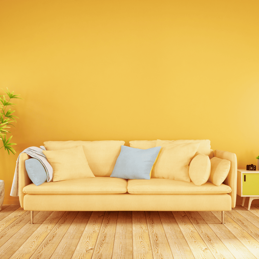 Yellow sofa in a living room with yellow walls