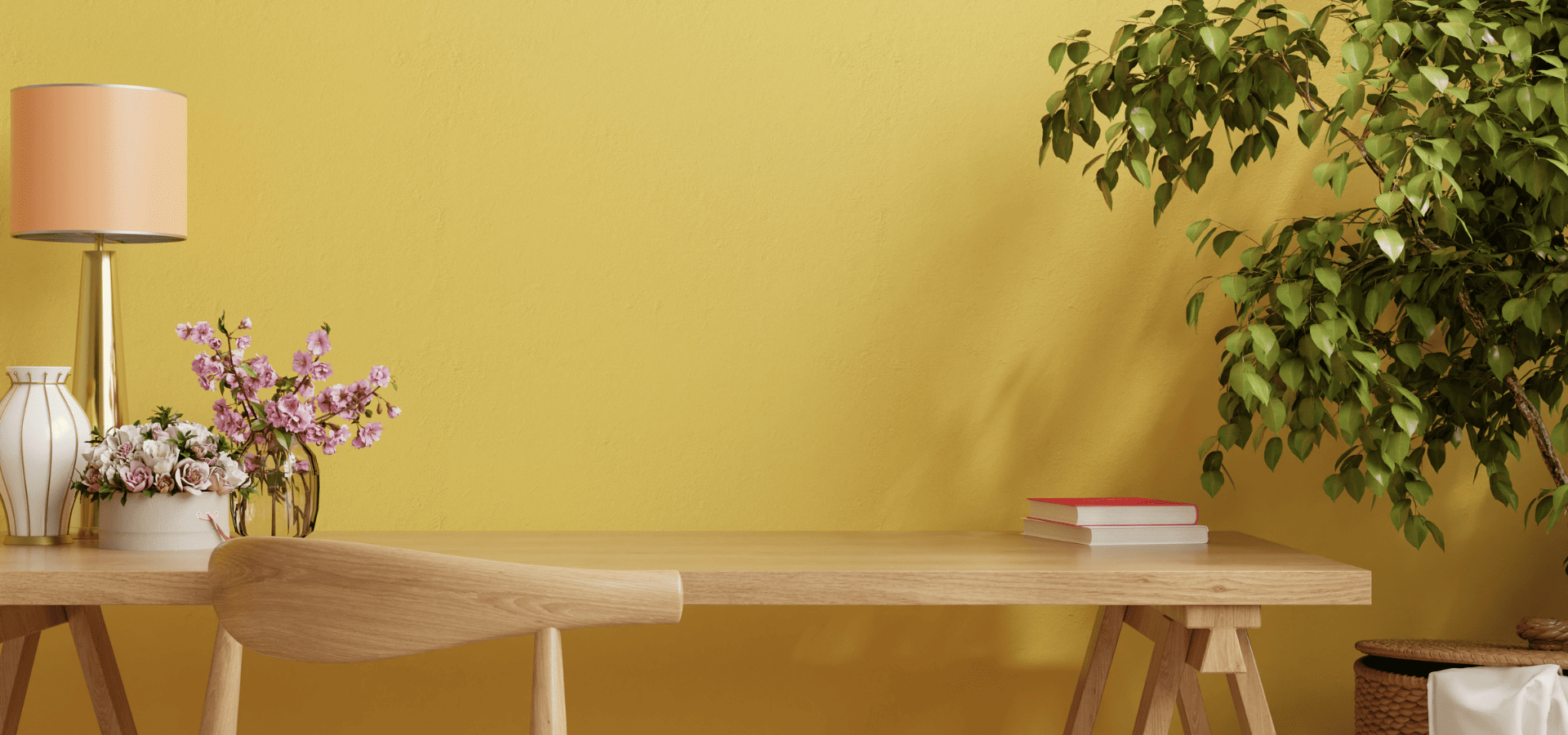 Yellow-themed home office setup with green and pink plants