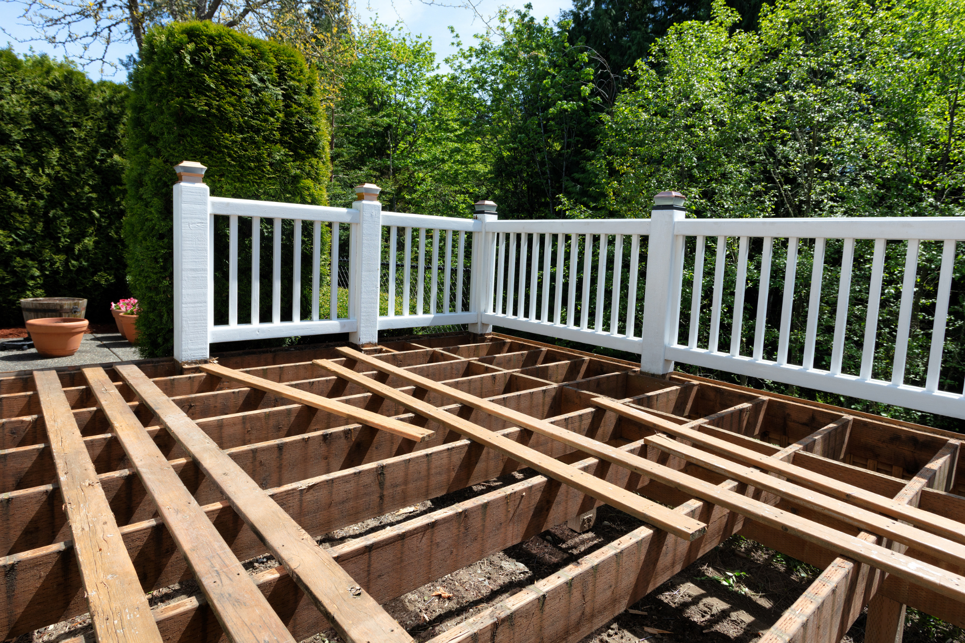A photo of deck that is in the process of being rebuilt. The deck needed it's deck boards to be replaced so in the photo there are no running boards on the deck.
