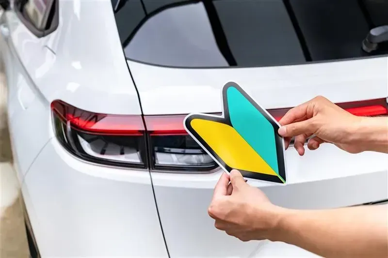 Hands attaching a Japanese