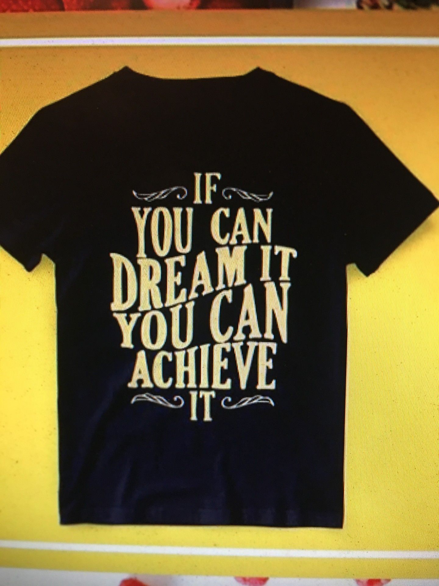 Black t-shirt with gold text: 