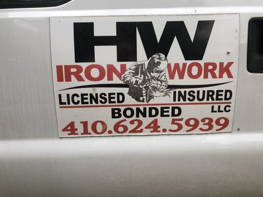 Ironwork company sign on a white vehicle: 