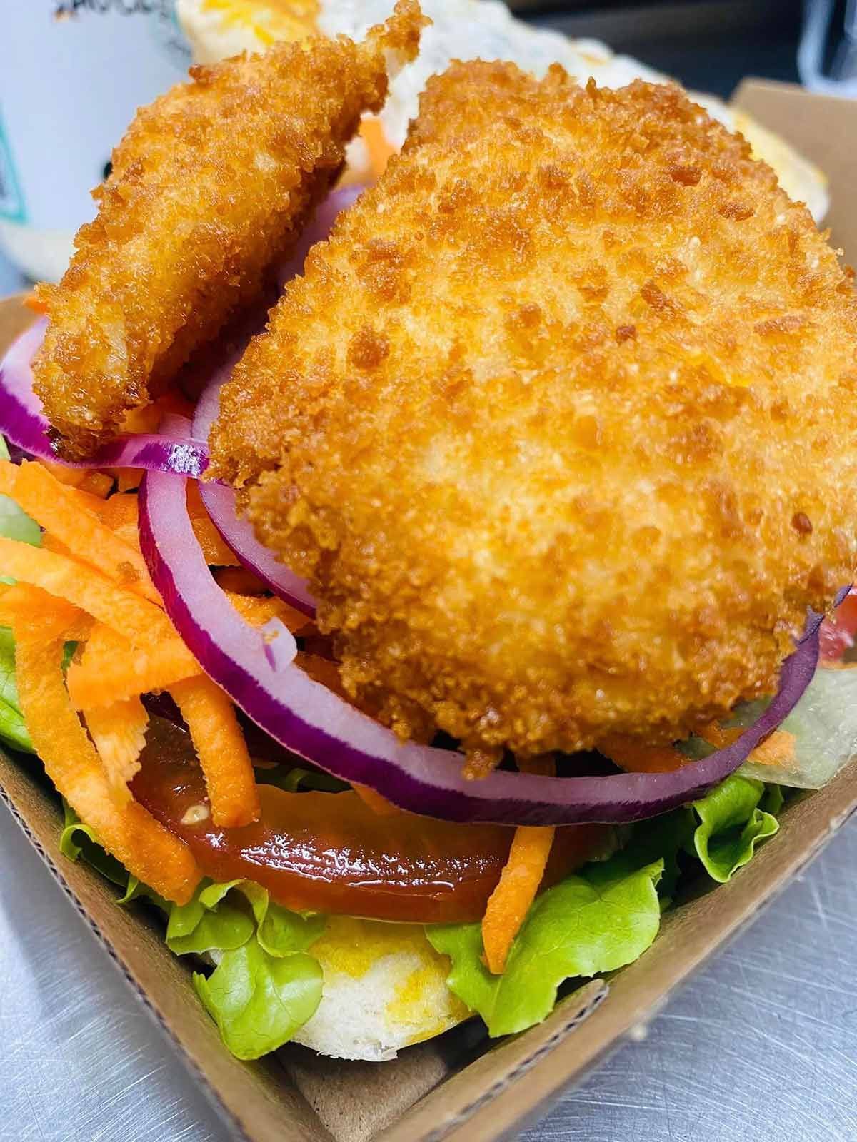 A Close Up of a Fried Chicken Sandwich — Cedar Park Fish & Chips In Taranganba, QLD