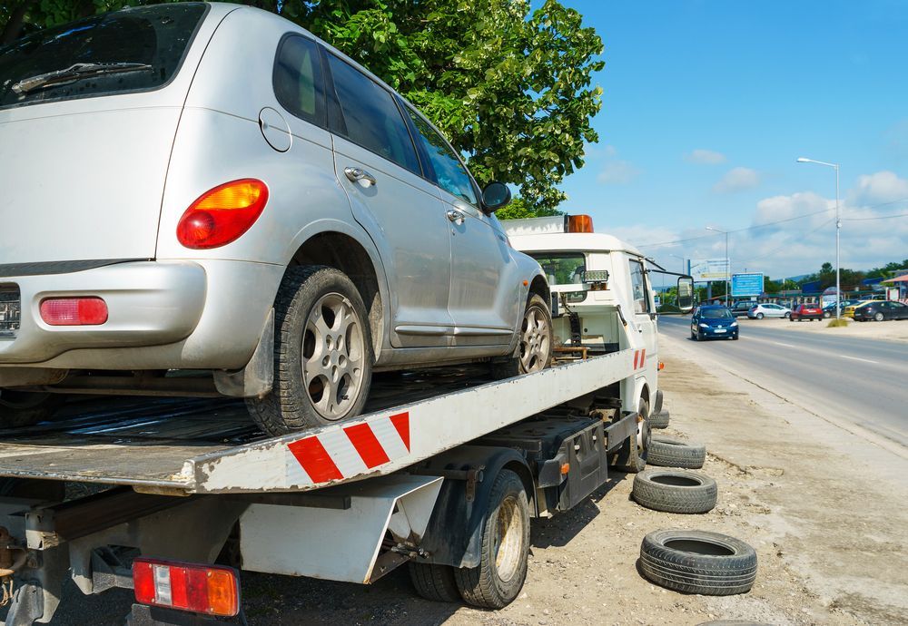 Tow Truck Carrying the Defective Car.