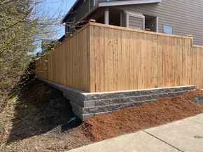 Expertly built fence with retaining wall below in Tumwater, WA