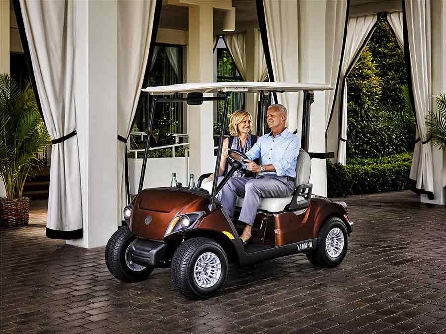 Golf Cart Service — Happy Couple In A Golf Cart in Reno, NV