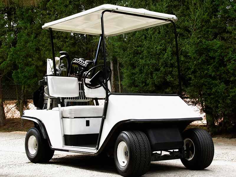 Golf Cart Repair — Golf Cart With Golf Club in Reno, NV