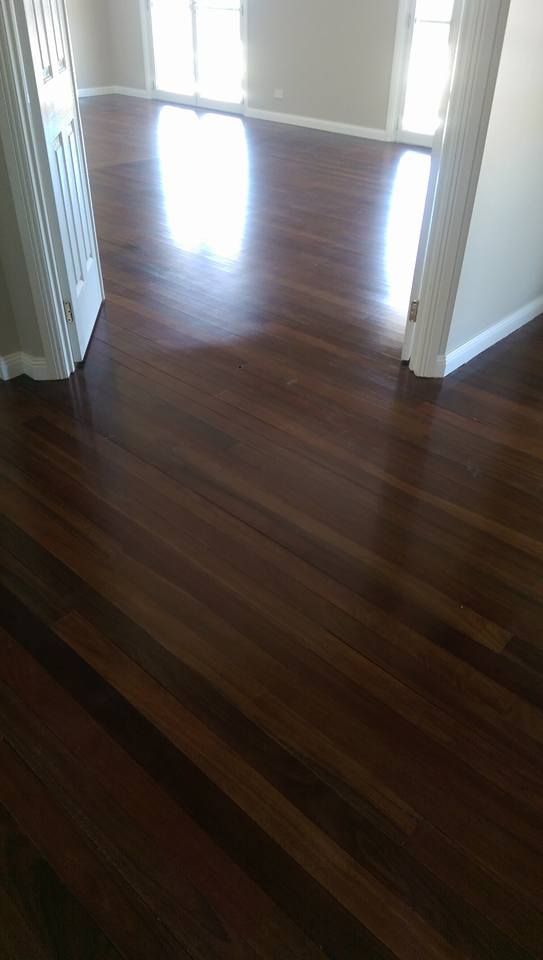 There is a wooden floor in the middle of a room.