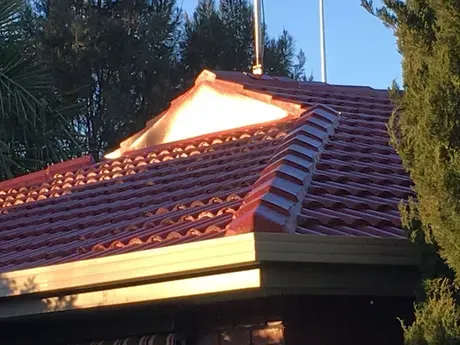 A Red Tiled Roof with a White Triangle on Top of It | Warragul, VIC | Roofshield