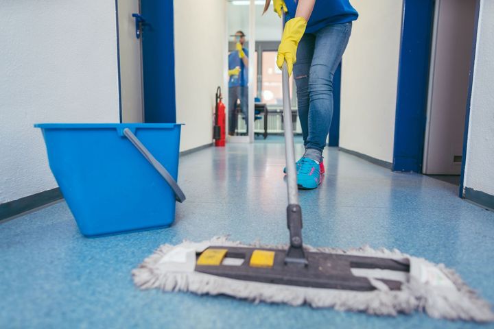 close cleaners moping floor hall