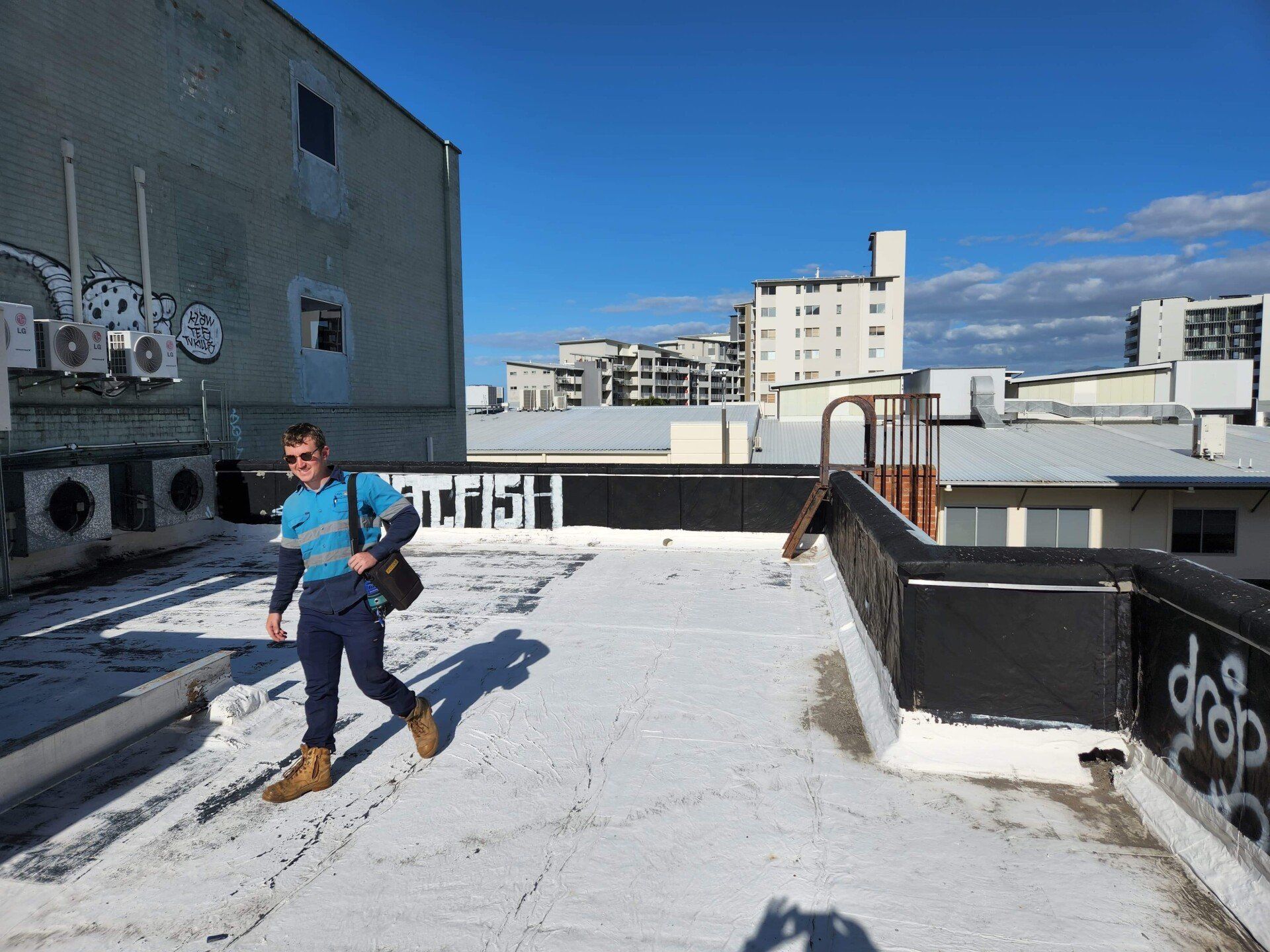 Commercial Electrician on Roof of Commercial Building — GSA Group In Garbutt, QLD