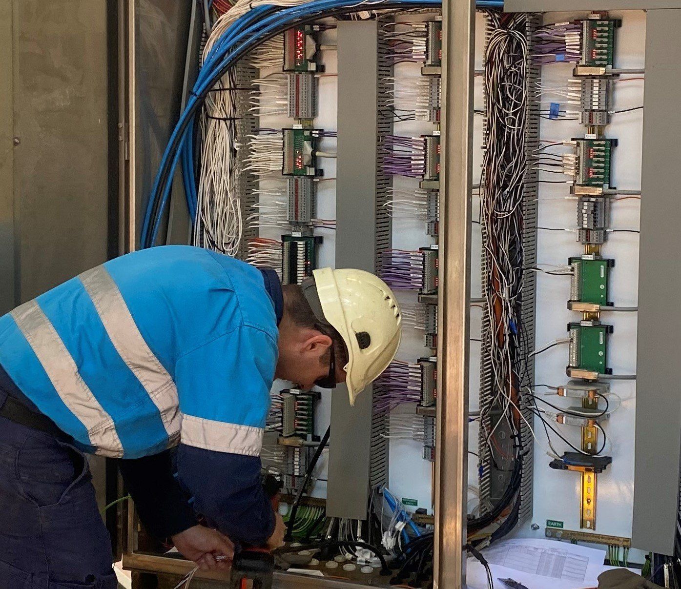 Industrial Electrician Working on Switchboard Upgrade — GSA Group In Garbutt, QLD