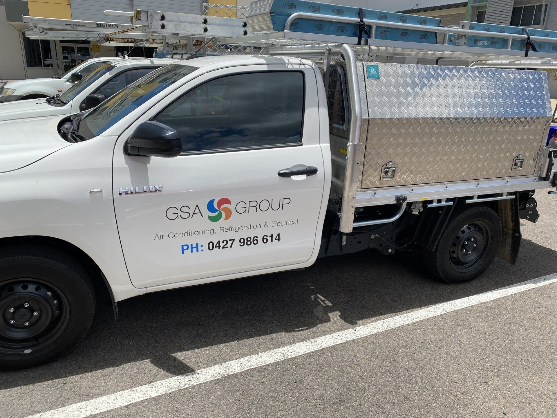 Electrician Changing Ceiling Light — GSA Group In Garbutt, QLD