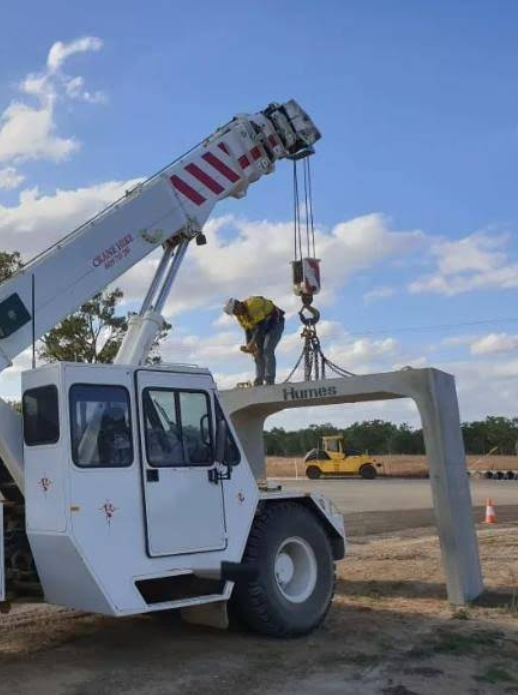 A Worker Supervising A Crane Lifting A Load Of Metal  Barriers— Mareeba Crane Hire In Mareeba, QLD