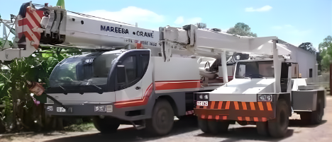 Two Crane Riggers Preparing A Crane For A Load — Mareeba Crane Hire In Mareeba, QLD