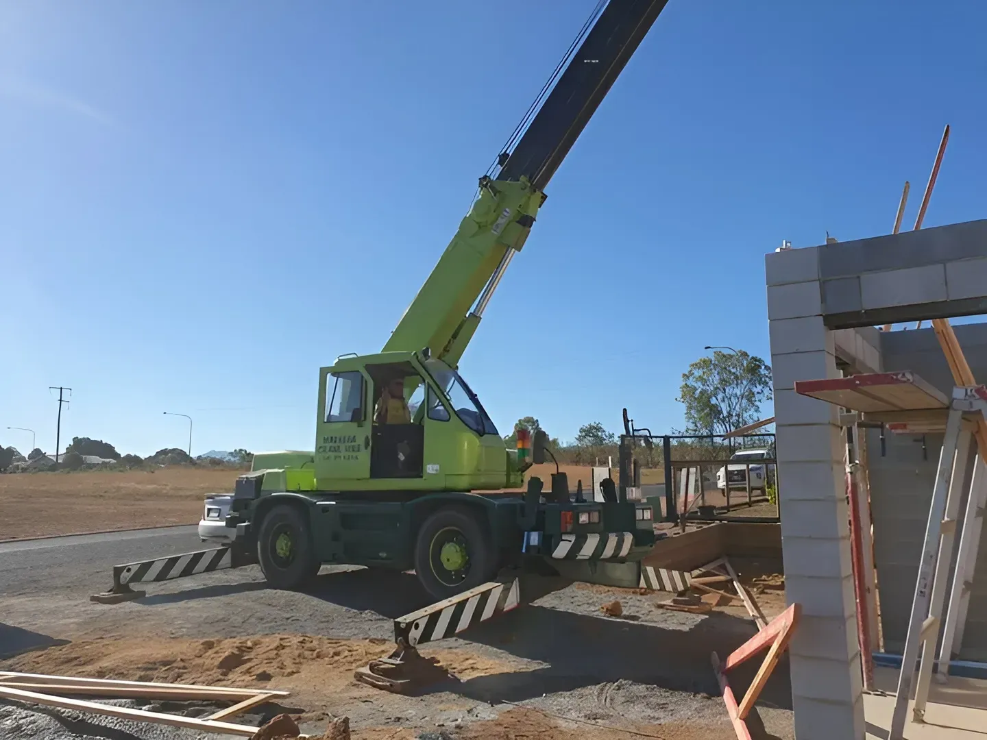 Yellow Crane at A Construction Site, Boom Extended — Mareeba Crane Hire In Mareeba, QLD
