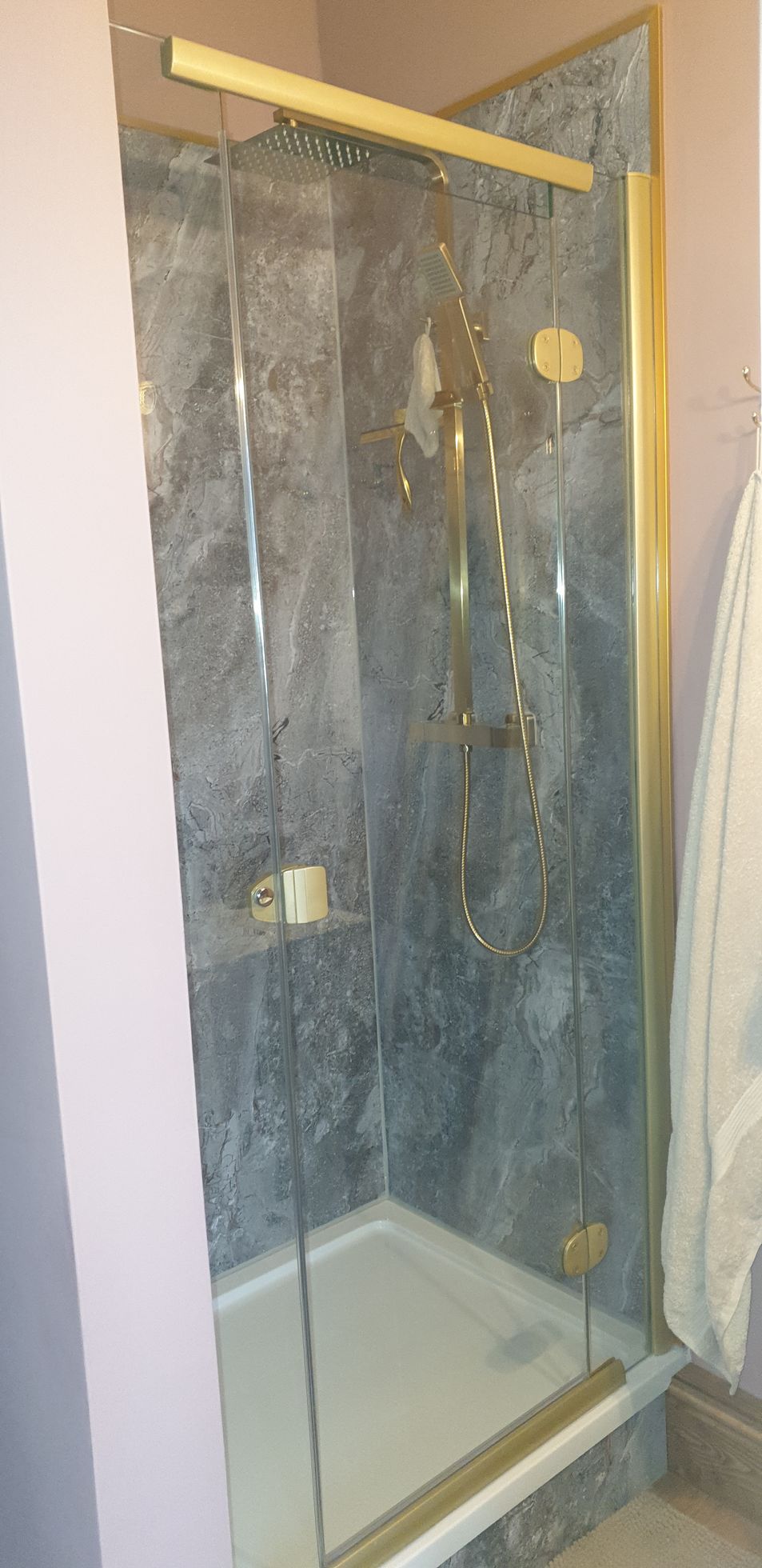 Shower wet walls and gold shower valves, fittings and accessories. Shower screens