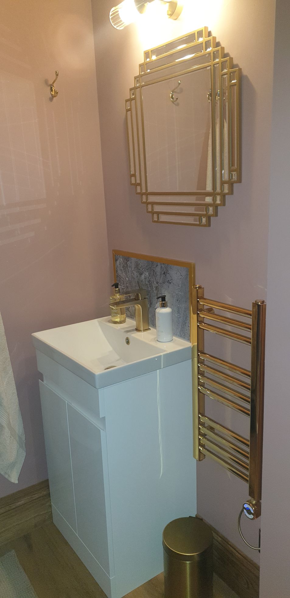 Art Deco en-suite fittings, gold mirror, gold towel rail, gold light