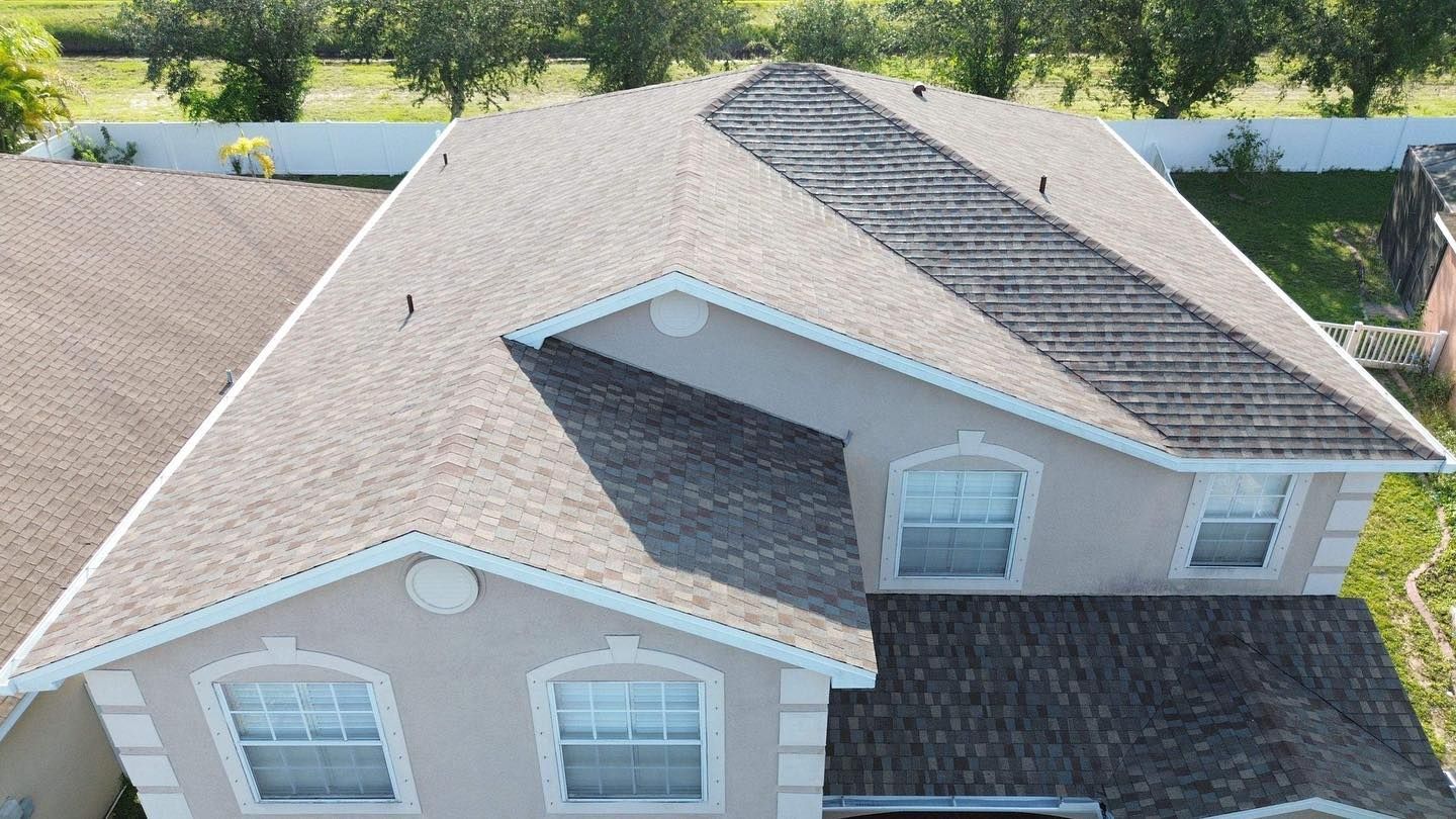 An aerial view of a house with a roof and windows.