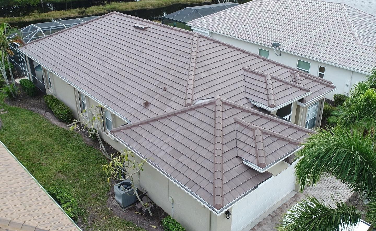 An aerial view of a house with a brown roof