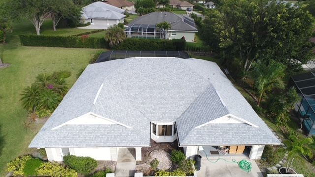 An aerial view of a house with a new roof.