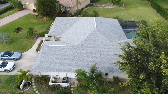 An aerial view of a house with a new roof.