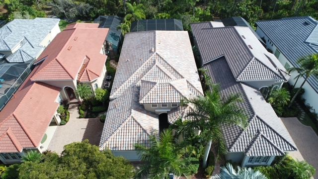 An aerial view of a residential area with lots of houses and trees.