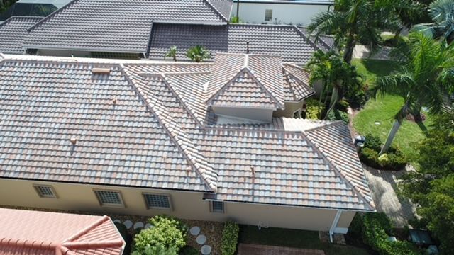 An aerial view of a house with a tiled roof.