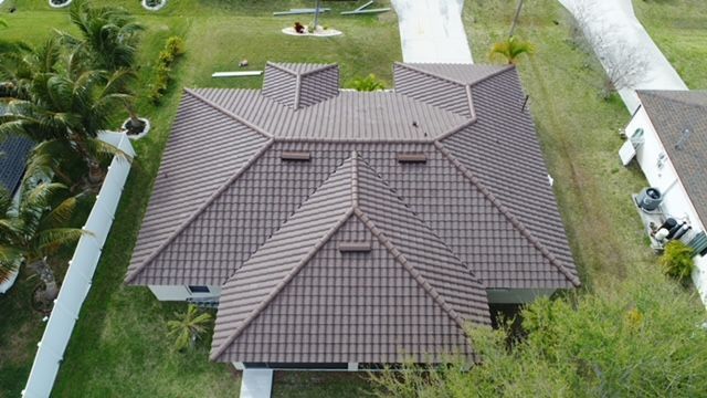 An aerial view of a house with a tiled roof.